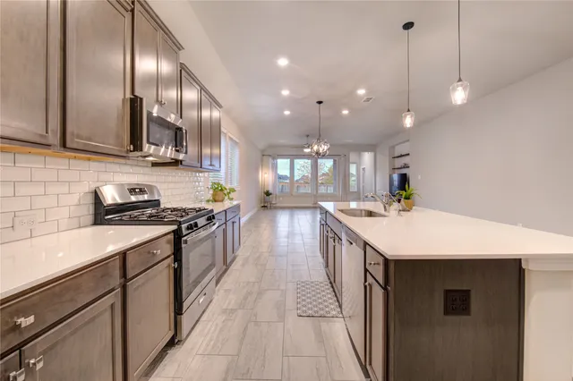 a kitchen with a stove and a sink