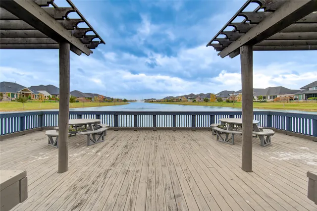 a view of a balcony with wooden floor