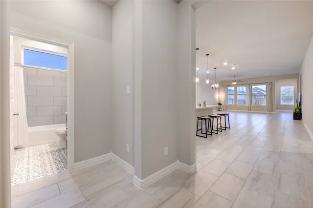 a view of a hallway with seating area