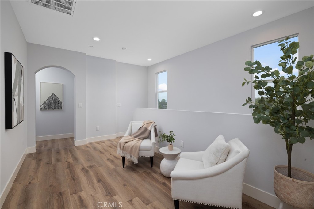 11237 Gladhill Road, Unit 6 Whittier, CA 90604 - Photo 18 of 34 a living room with furniture and a potted plant