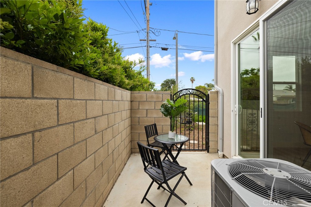 11237 Gladhill Road, Unit 6 Whittier, CA 90604 - Photo 32 of 34 a patio with table and chairs and potted plants