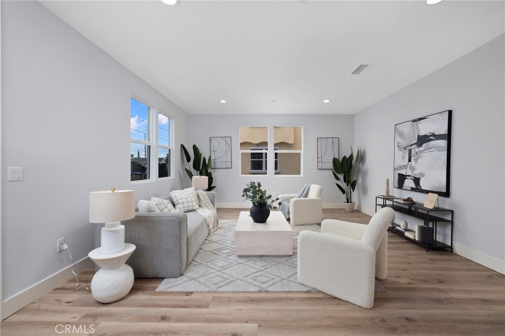 11237 Gladhill Road, Unit 6 Whittier, CA 90604 - Photo 5 of 34 a living room with furniture or couch and a wooden floor