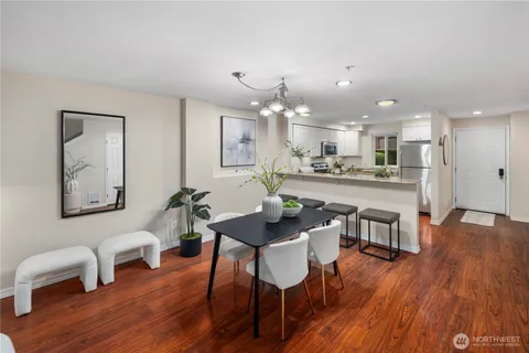 a kitchen with stainless steel appliances granite countertop a refrigerator sink and stove