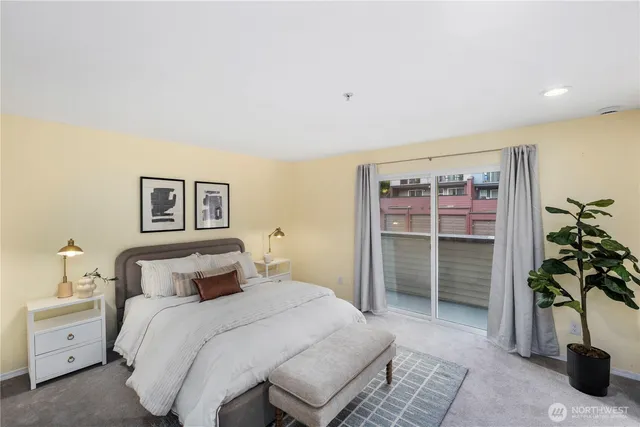 a bedroom with a bed and a potted plant