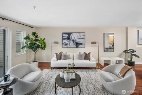a view of a dining room with furniture wooden floor and chandelier