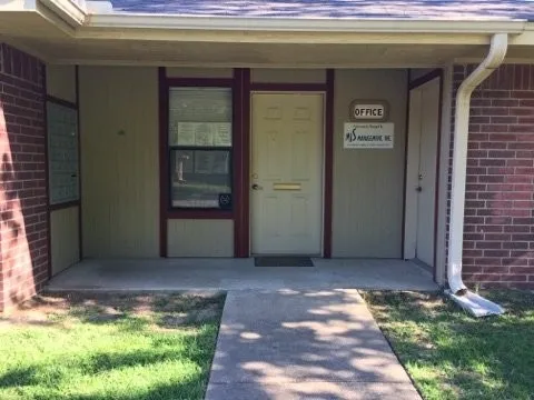 a view of backyard with entryway