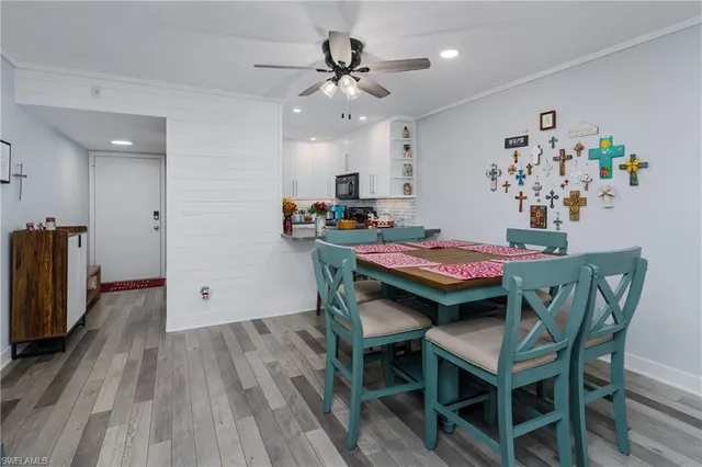 a view of a dining room with furniture and wooden floor