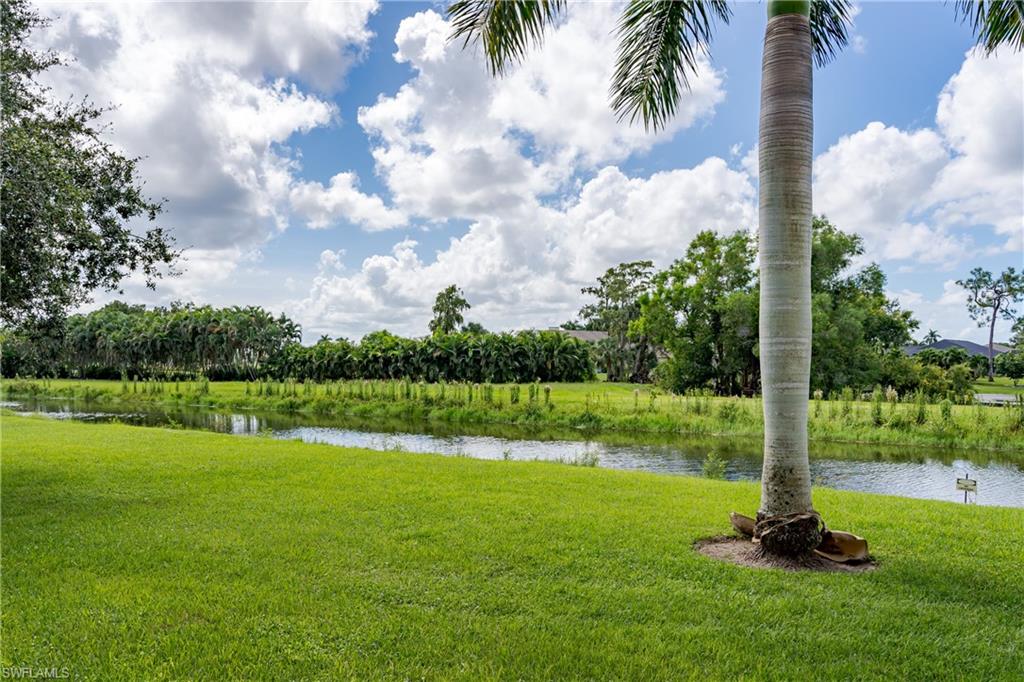 5499 Rattlesnake Hamm Road, Unit 304A Naples, FL 34113 - Photo 24 of 30 a view of a park with a fountain