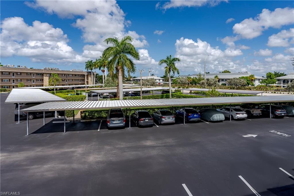 5499 Rattlesnake Hamm Road, Unit 304A Naples, FL 34113 - Photo 28 of 30 a view of a swimming pool with furniture