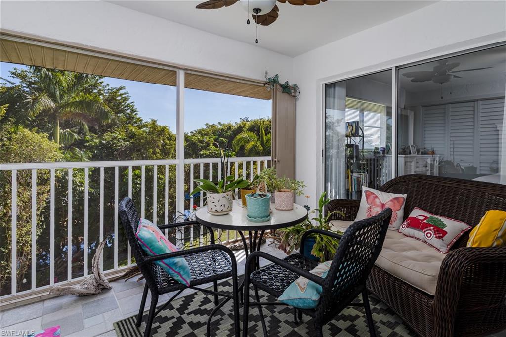 5499 Rattlesnake Hamm Road, Unit 304A Naples, FL 34113 - Photo 4 of 30 a view of a dining room with furniture window and outside view
