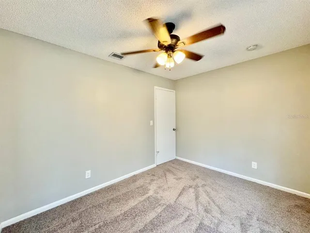 a view of a big room with wooden floor