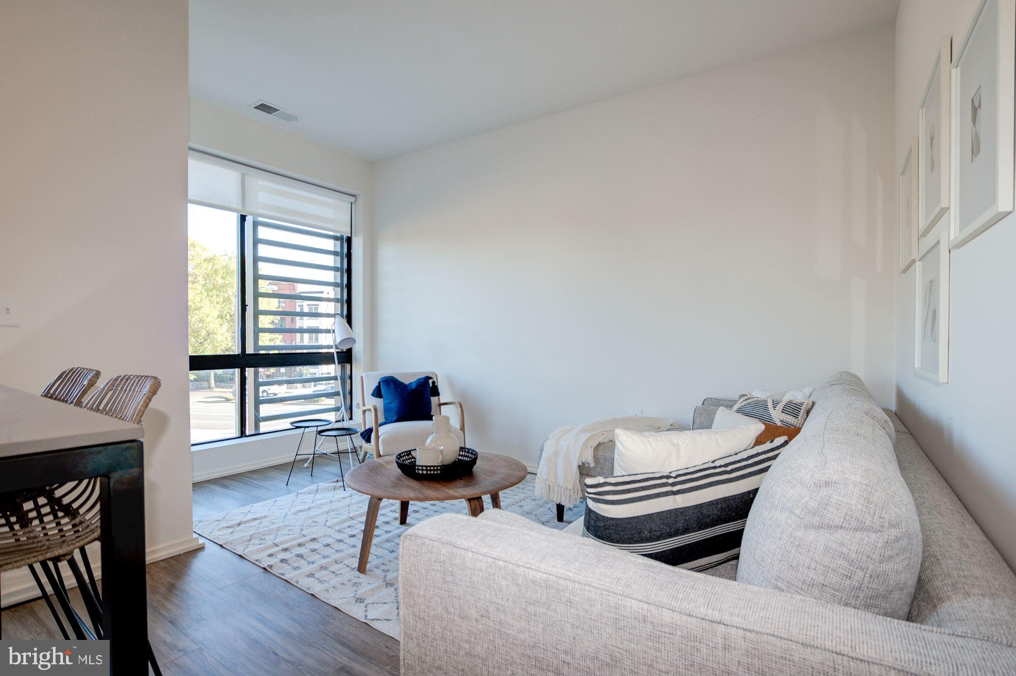 1550 11th Street Northwest, Unit 203 Washington, DC 20005 - Photo 2 of 21 Wall of Windows with Eastern Exposure