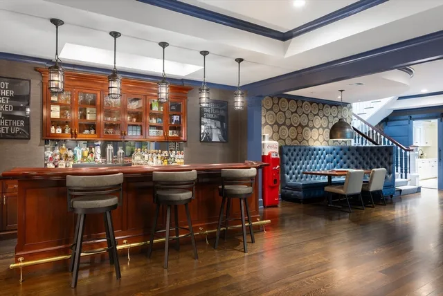 a dining room with a wooden table and chairs