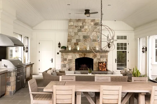 a living room with fireplace furniture and a fireplace