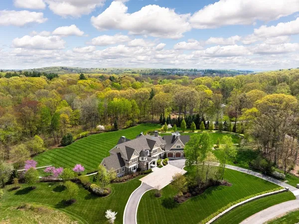 a view of a lake with a house in the background