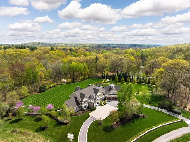 a view of a lake with a house in the background