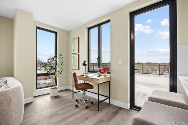 a view of a livingroom with furniture and a window