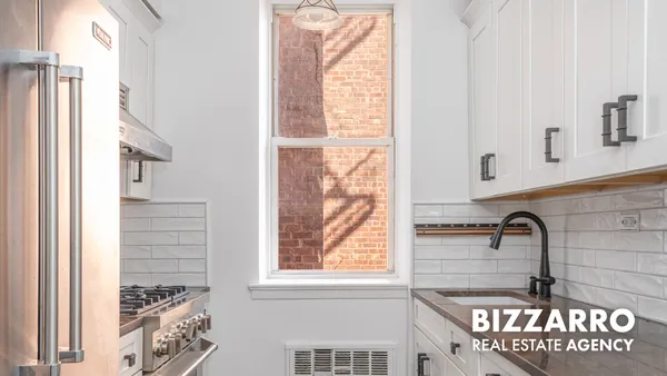 a bathroom with a sink and a window