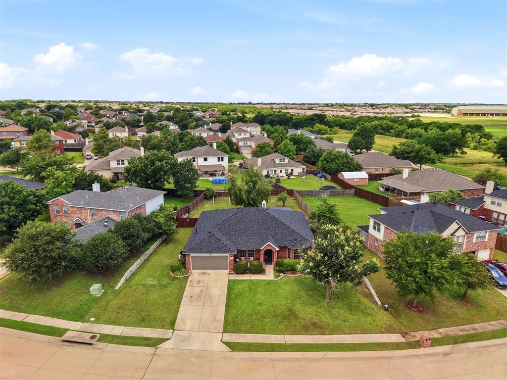 1213 Hampton Drive Forney, TX 75126 - Photo 24 of 27 an aerial view of residential houses with outdoor space and trees