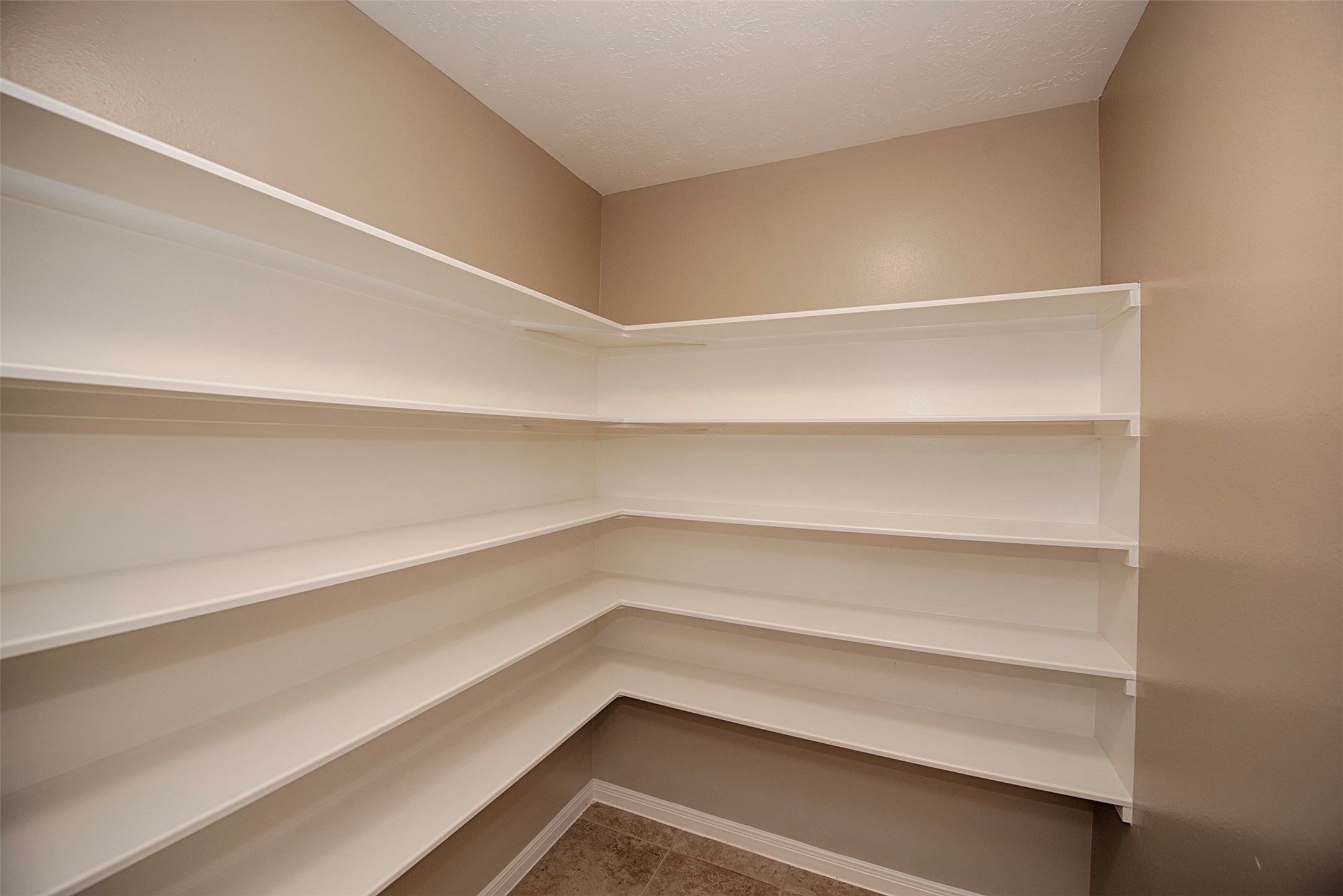 6714 Lone Star Ridge Manvel, TX 77578 - Photo 14 of 37 a storage room with wooden floor
