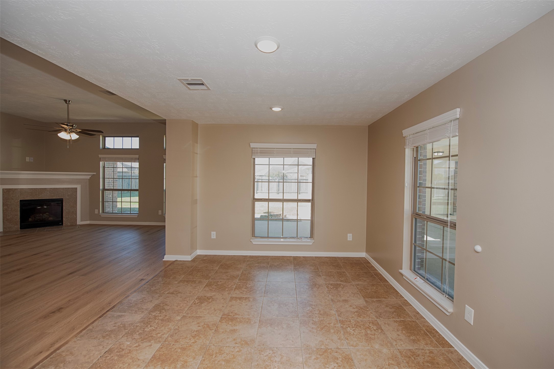 6714 Lone Star Ridge Manvel, TX 77578 - Photo 16 of 37 a view of an empty room with wooden floor and a window