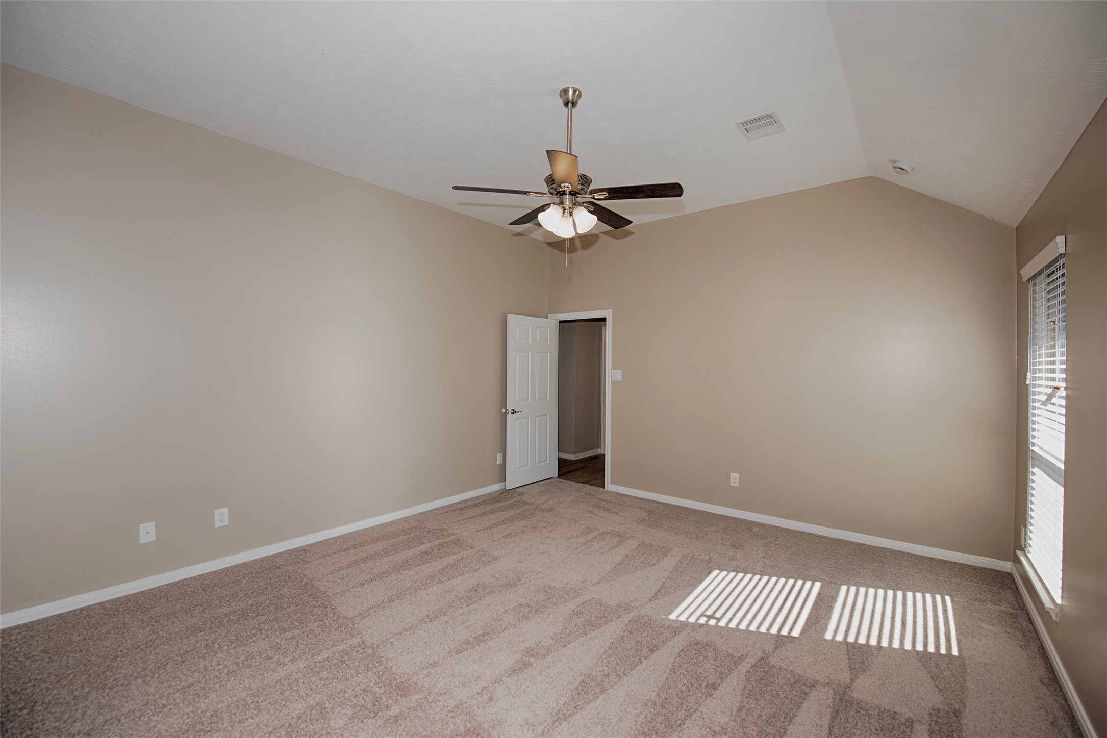 6714 Lone Star Ridge Manvel, TX 77578 - Photo 20 of 37 a view of a room with a ceiling fan and a window