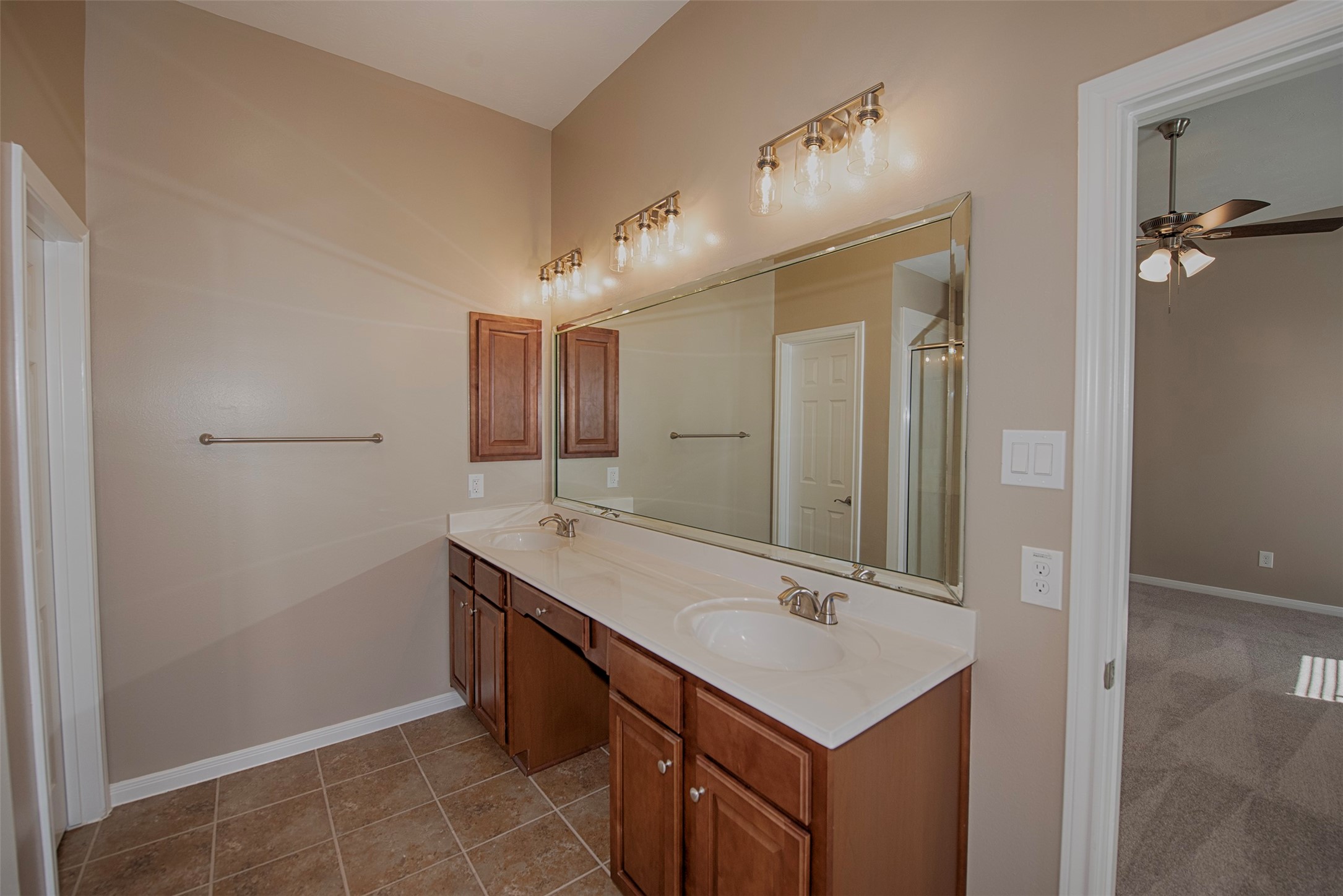 6714 Lone Star Ridge Manvel, TX 77578 - Photo 22 of 37 a bathroom with a sink vanity and a mirror