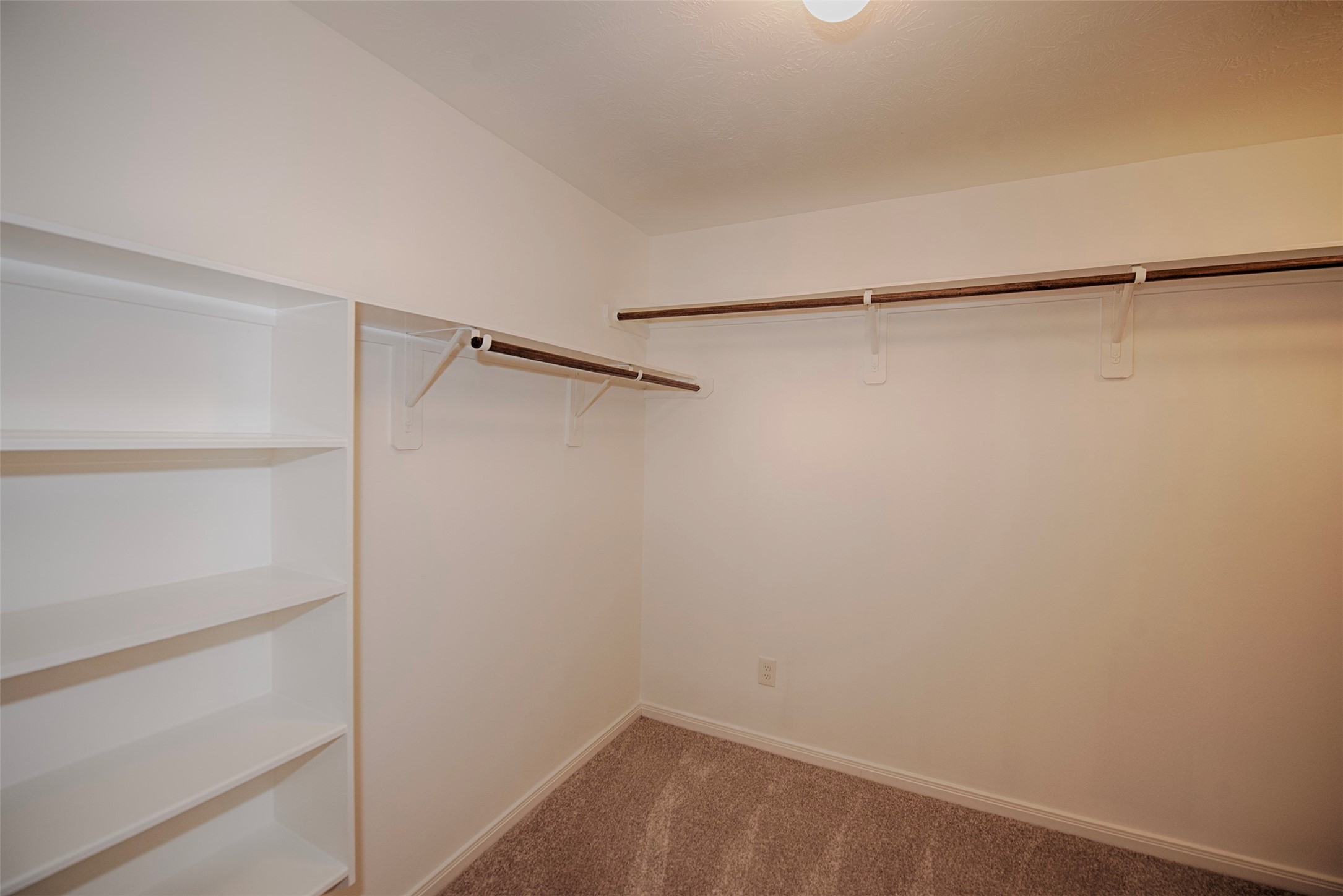 6714 Lone Star Ridge Manvel, TX 77578 - Photo 24 of 37 a view of small space with racks on the wall