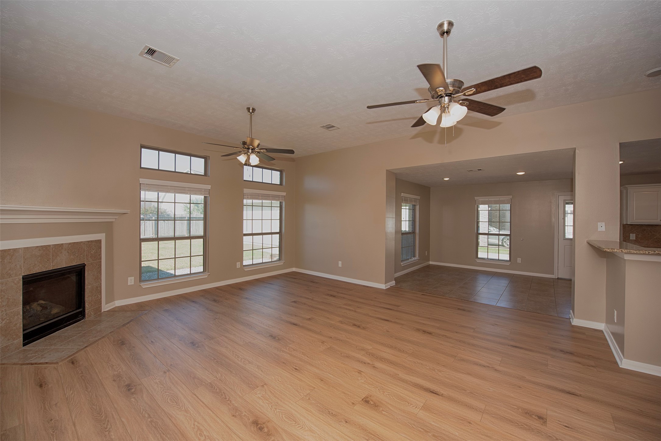 6714 Lone Star Ridge Manvel, TX 77578 - Photo 8 of 37 a view of an empty room with window and wooden floor