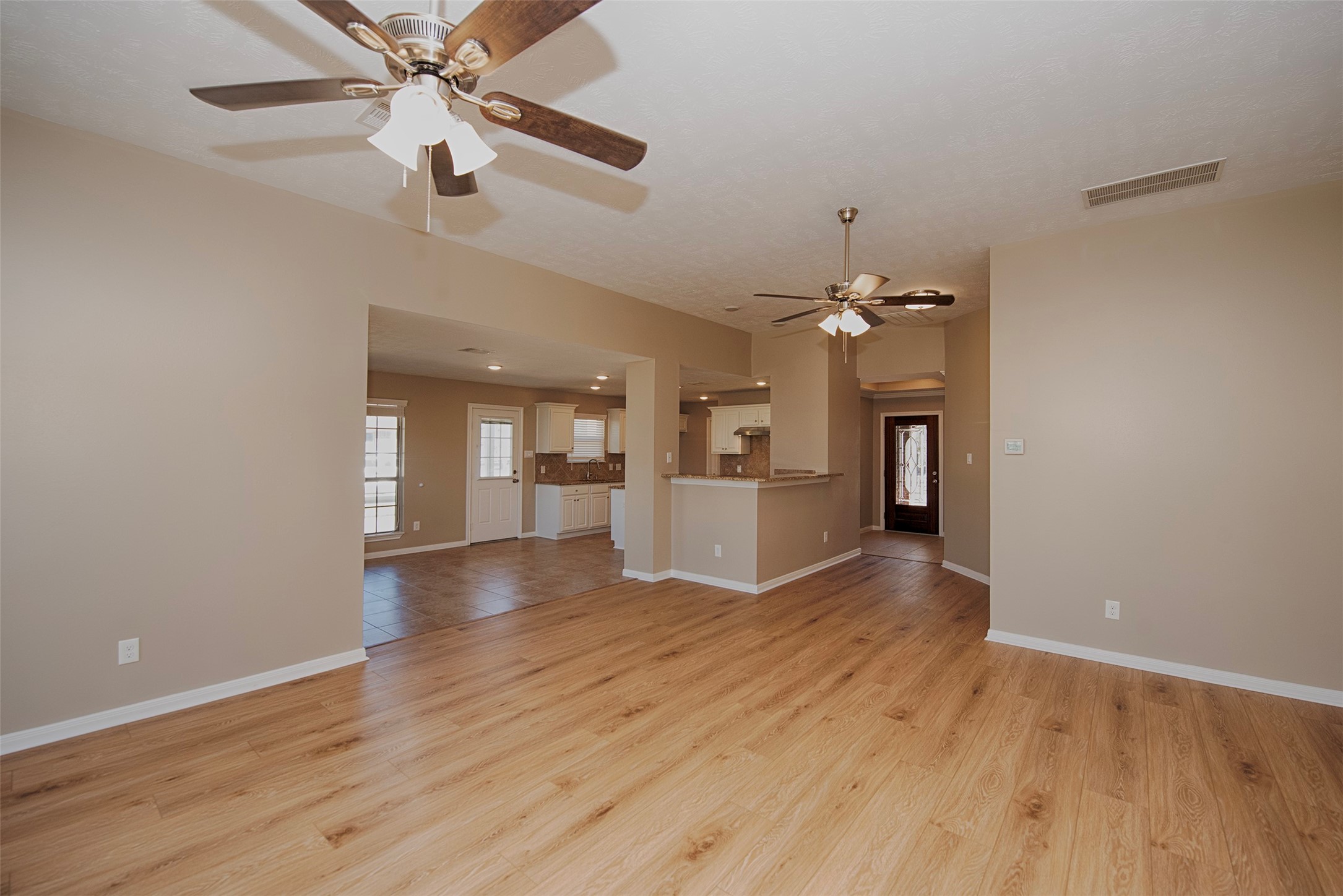 6714 Lone Star Ridge Manvel, TX 77578 - Photo 9 of 37 wooden floor in an empty room with a window