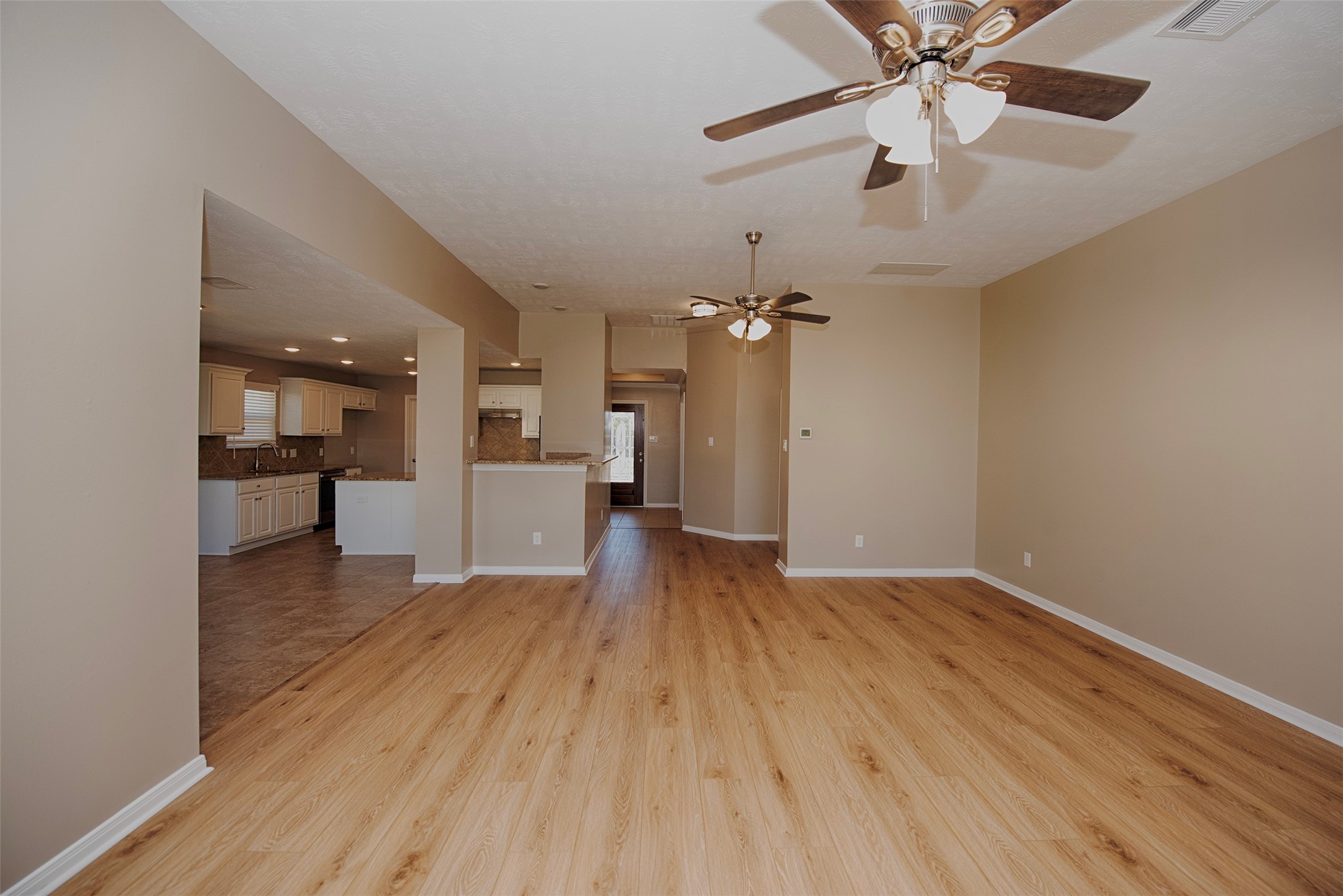 6714 Lone Star Ridge Manvel, TX 77578 - Photo 10 of 37 wooden floor in an empty room with a window