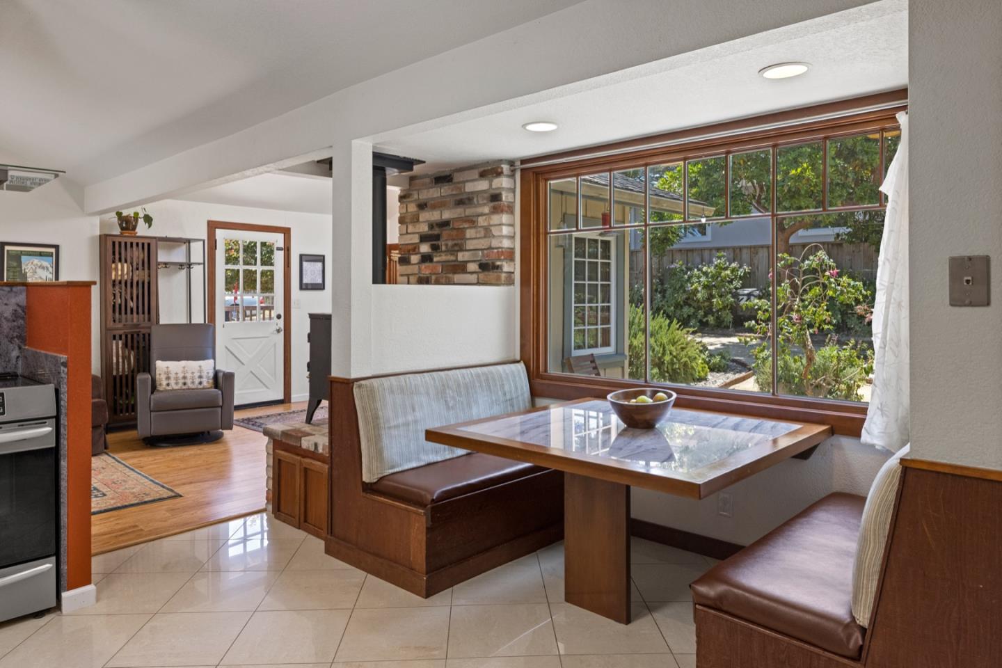 314 3rd Street Pacific Grove, CA 93950 - Photo 15 of 35 a living room with furniture and large windows