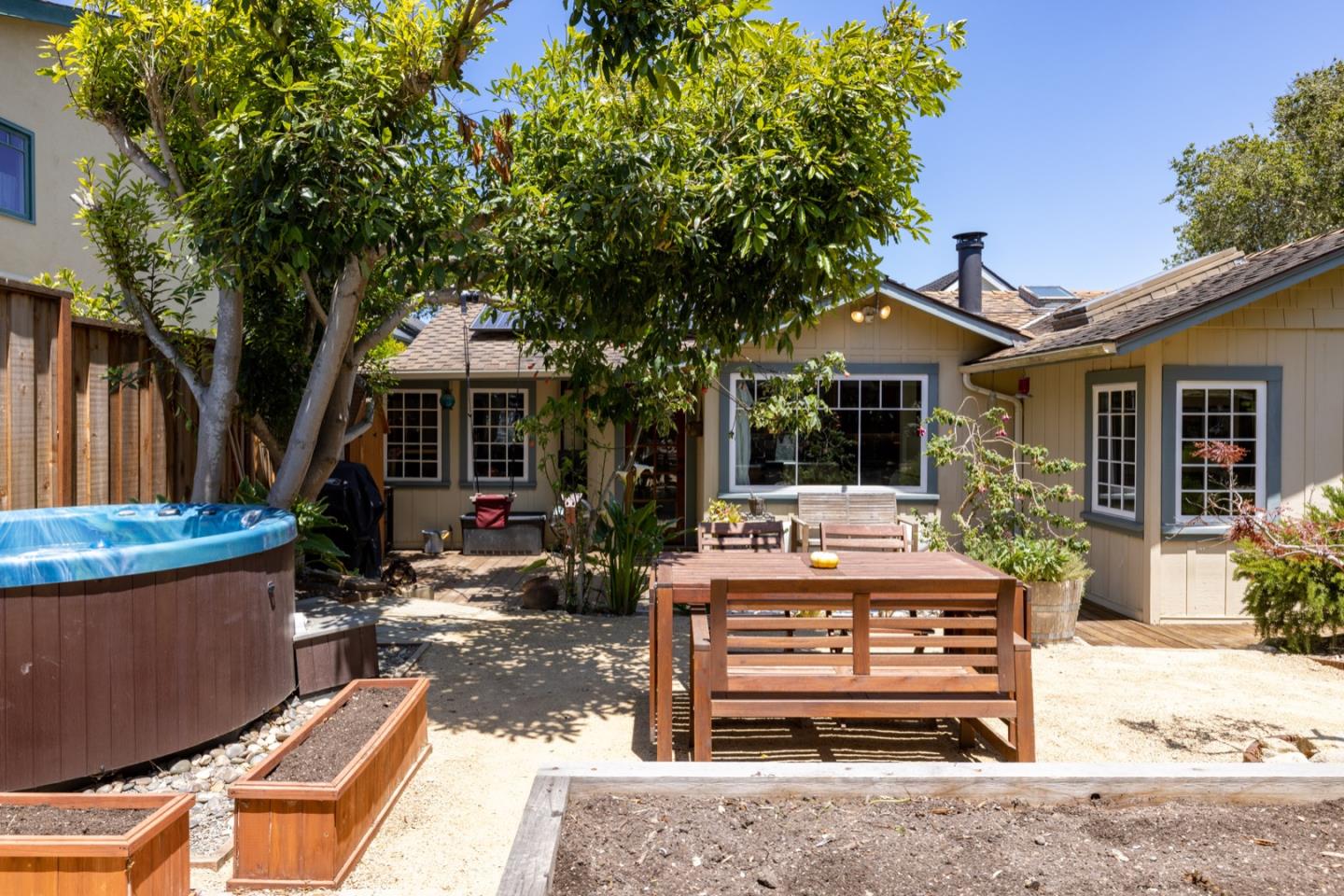314 3rd Street Pacific Grove, CA 93950 - Photo 27 of 35 a view of a house with backyard sitting area and porch