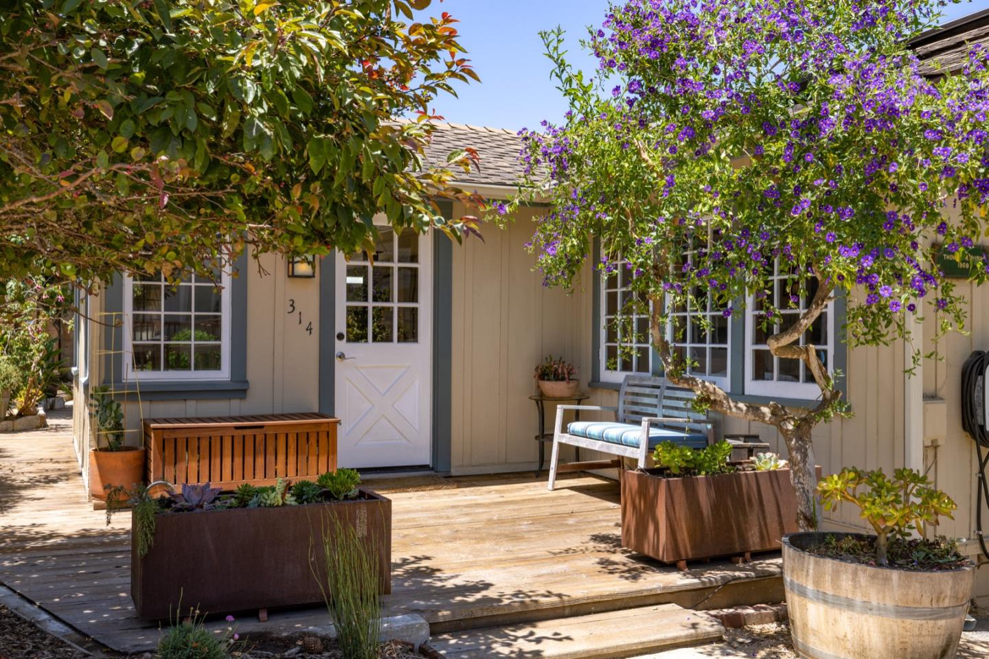 314 3rd Street Pacific Grove, CA 93950 - Photo 5 of 35 a view of a patio with table and chairs and potted plants