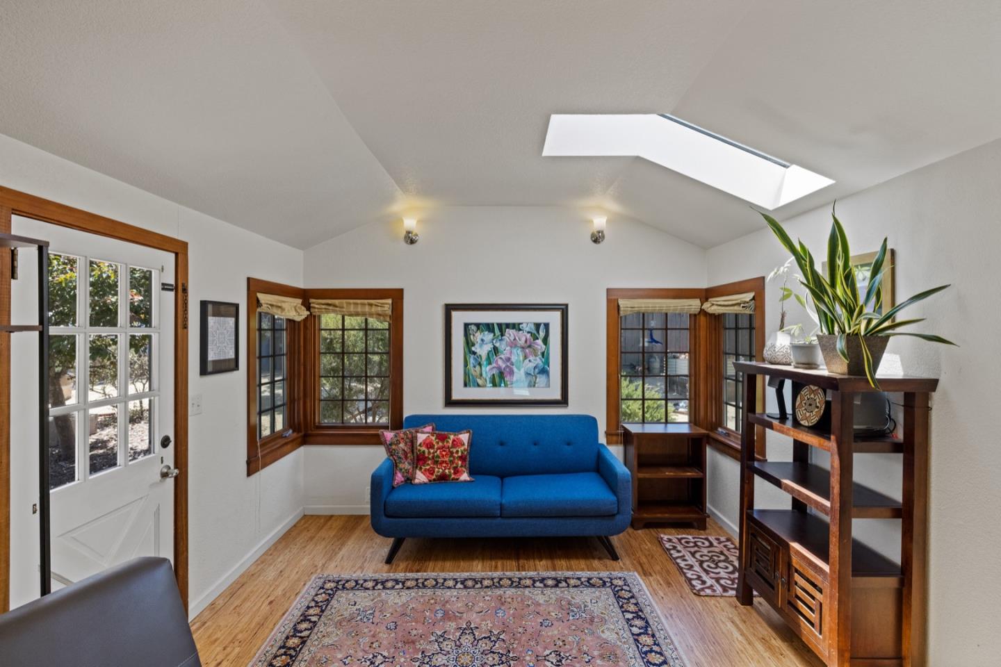 314 3rd Street Pacific Grove, CA 93950 - Photo 9 of 35 a living room with furniture and a potted plant
