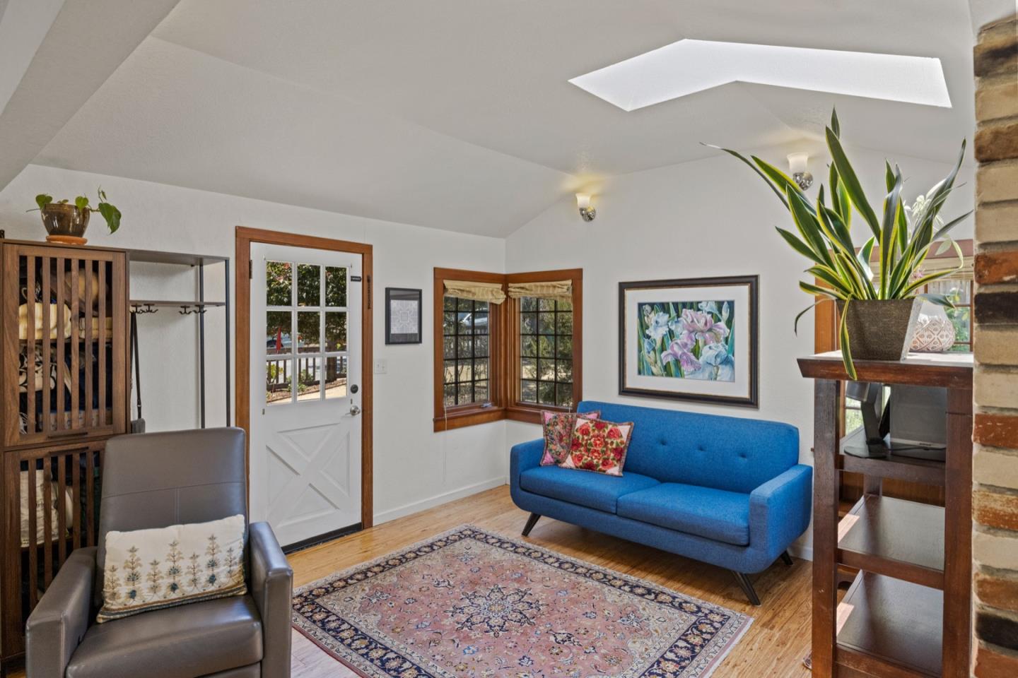 314 3rd Street Pacific Grove, CA 93950 - Photo 10 of 35 a living room with furniture and a potted plant
