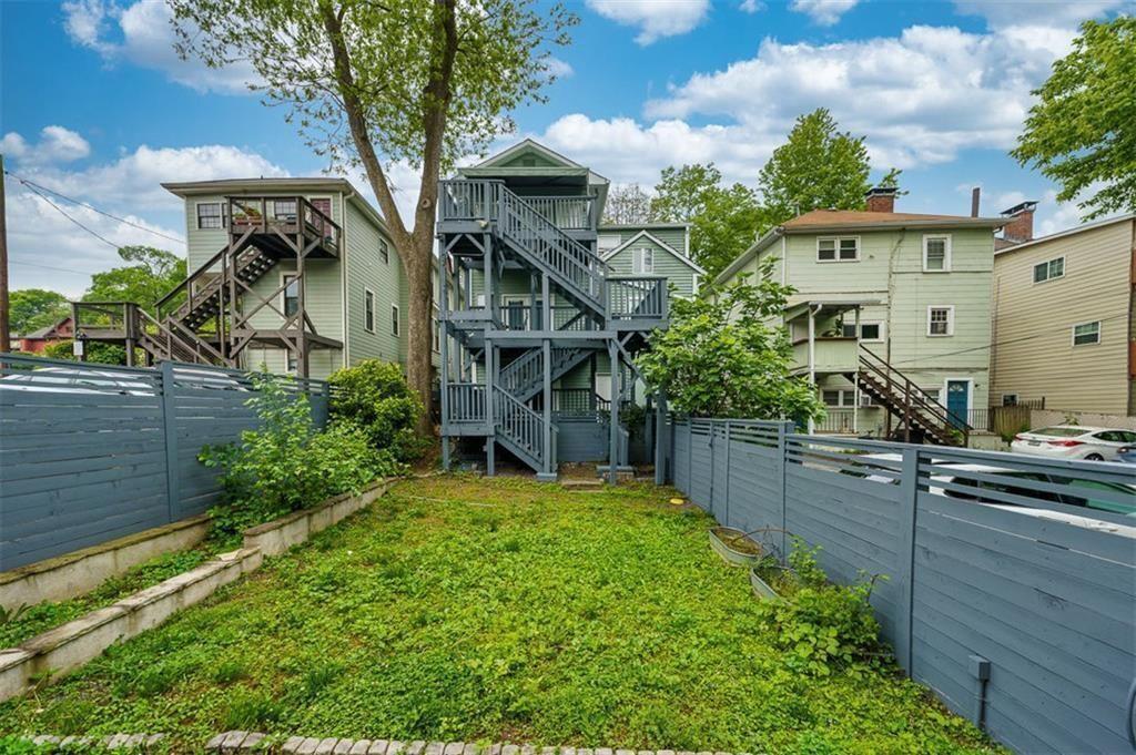 693 Myrtle Street Northeast Atlanta, GA 30308 - Photo 6 of 35 a view of a house with a flower garden
