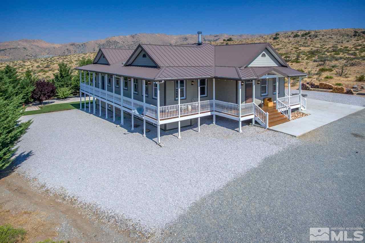 1290 Antelope Valley Road Reno, NV 89508 - Photo 1 of 1 a view of a house with wooden deck and furniture
