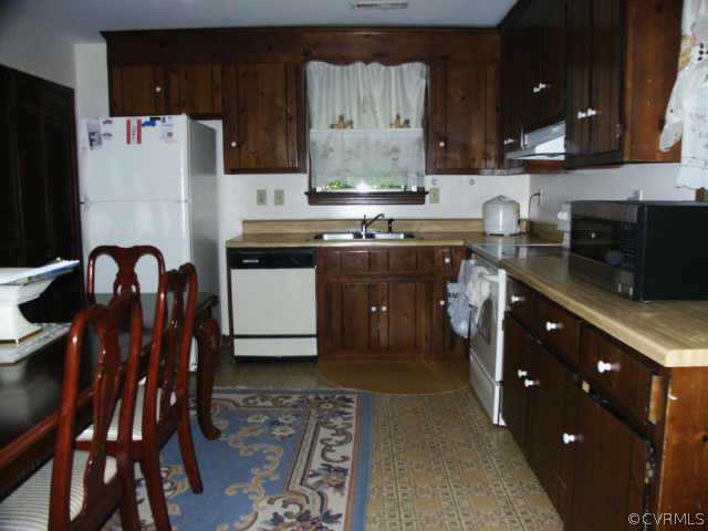 4903 Court Ridge Terrace Midlothian, VA 23112 - Photo 6 of 10 a kitchen with stainless steel appliances granite countertop a refrigerator and a stove top oven