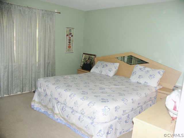 4903 Court Ridge Terrace Midlothian, VA 23112 - Photo 7 of 10 a bedroom with a bed and a window