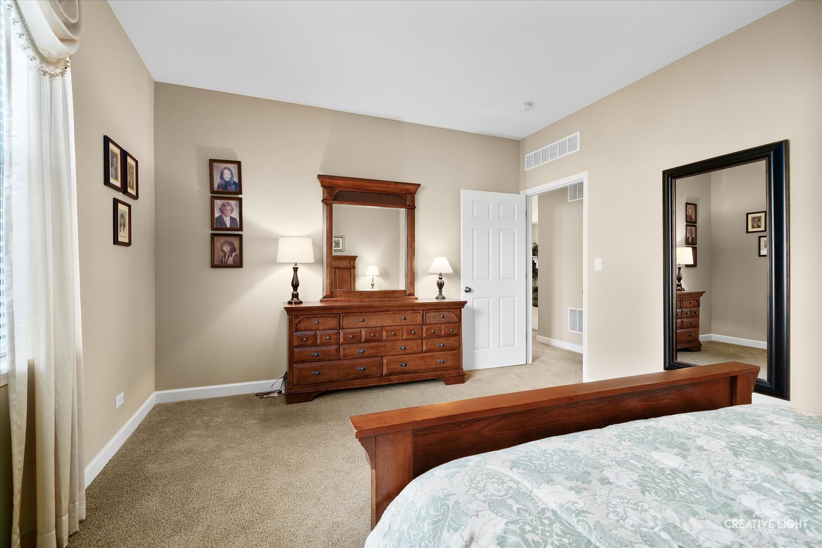 757 Bellevue Circle Oswego, IL 60543 - Photo 13 of 19 a bedroom with a bed and a dresser