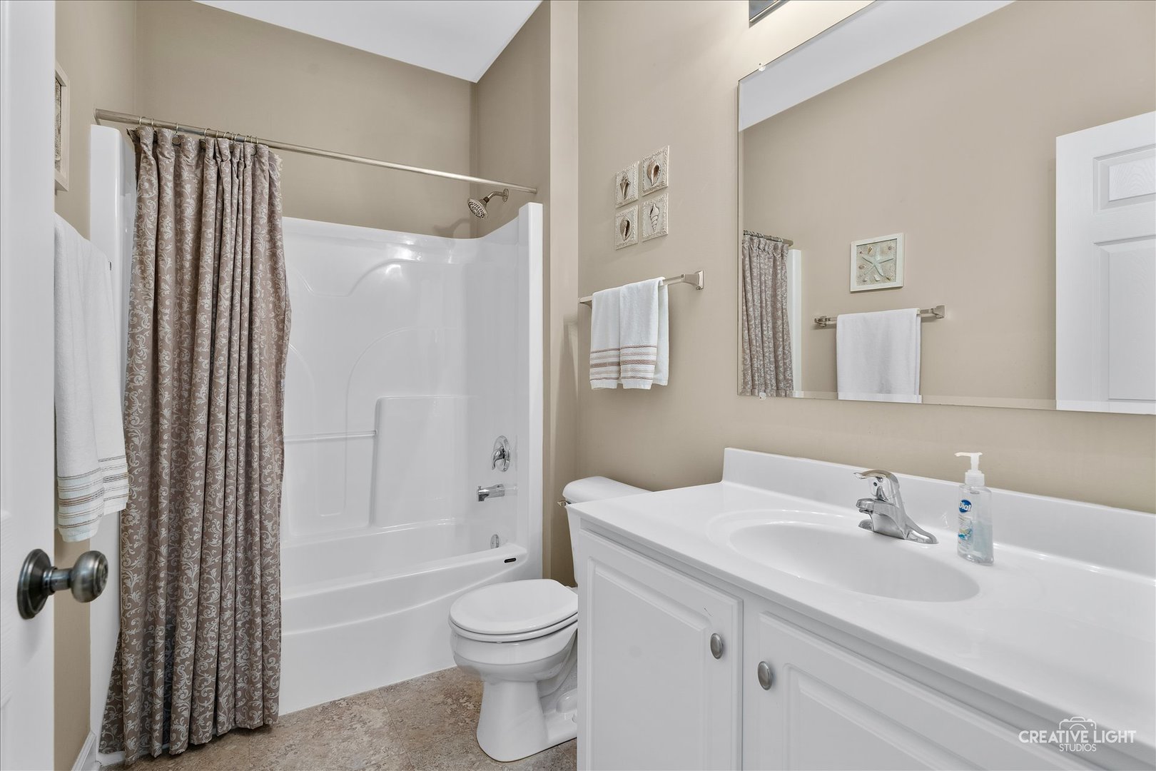 757 Bellevue Circle Oswego, IL 60543 - Photo 5 of 19 a bathroom with a sink toilet and shower