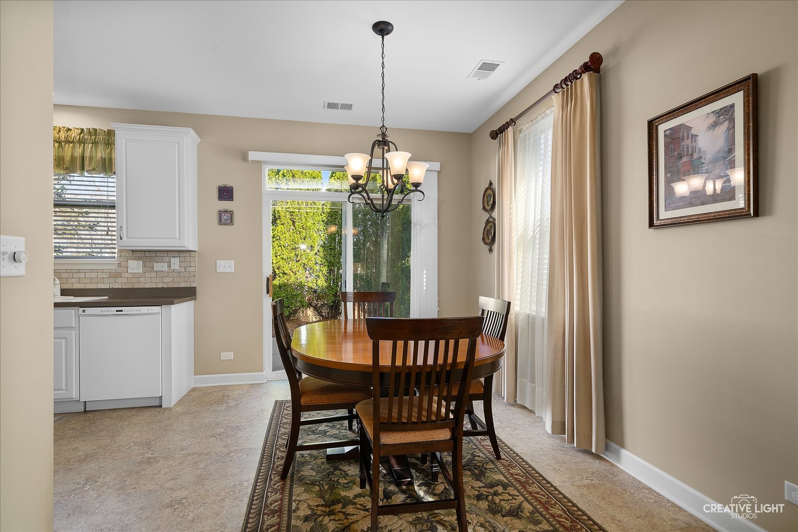 757 Bellevue Circle Oswego, IL 60543 - Photo 8 of 19 a dining room with furniture a chandelier and window