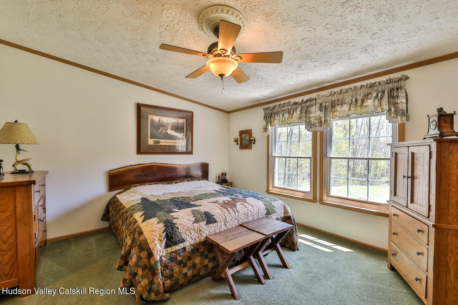 751 Mitchell Hollow Road Windham, NY 12496 - Photo 29 of 37 a bedroom with a bed and a large window with a chandelier