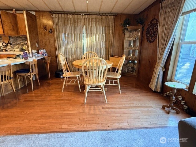 201 Union Avenue Southeast, Unit 193 Renton, WA 98059 - Photo 3 of 9 a view of a dining room with furniture window and wooden floor