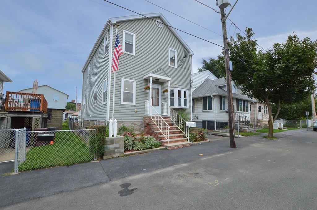 56 Curtis Road Revere, MA 02151 - Photo 1 of 22 a view of a street with houses