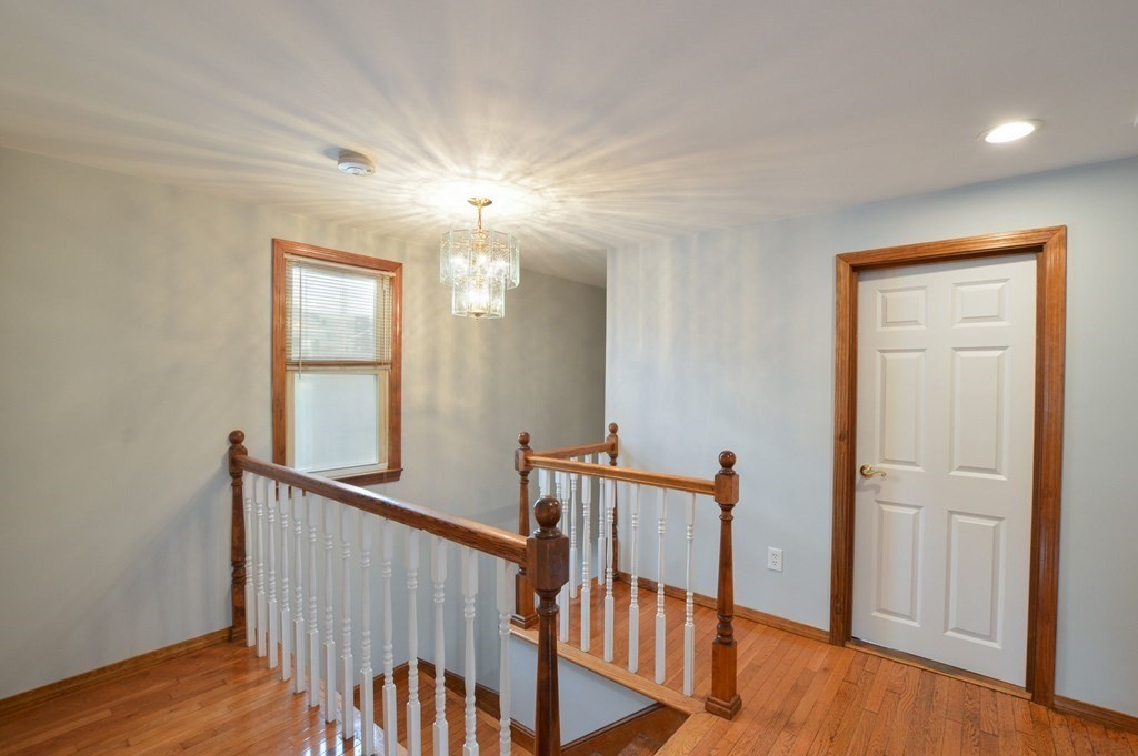 56 Curtis Road Revere, MA 02151 - Photo 13 of 22 a view of a hallway with windows and stairs