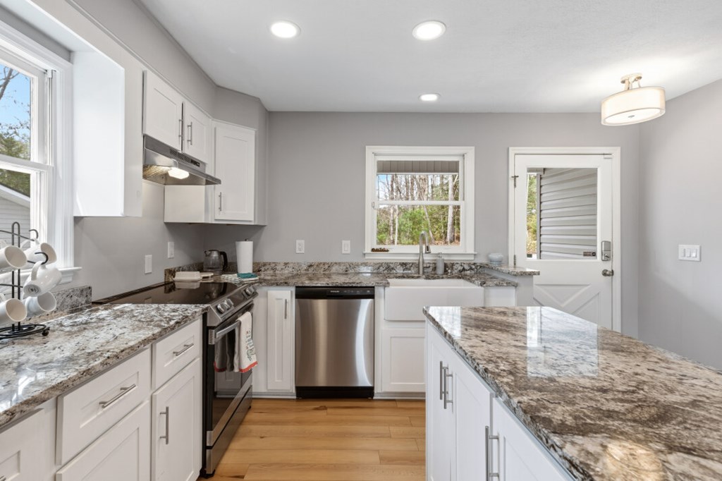 1682 Settlement Road Young Harris, GA 30582 - Photo 13 of 72 a kitchen with a sink stove and cabinets