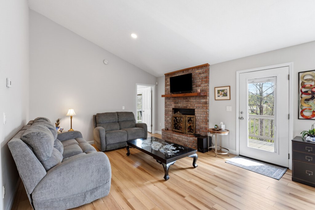 1682 Settlement Road Young Harris, GA 30582 - Photo 14 of 72 a living room with furniture and a fireplace