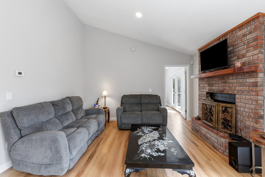 1682 Settlement Road Young Harris, GA 30582 - Photo 15 of 72 a living room with furniture and a fireplace